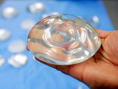 Detection of some breast cancers related to silicone breast augmentation