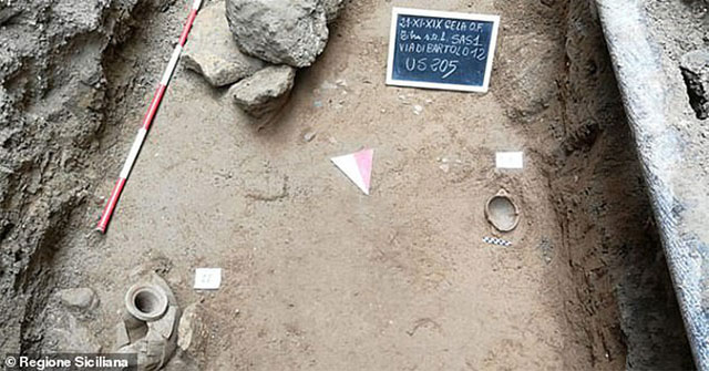 Digging the road to install fiber-optic cable, discovering an odd 1,300-year-old tomb