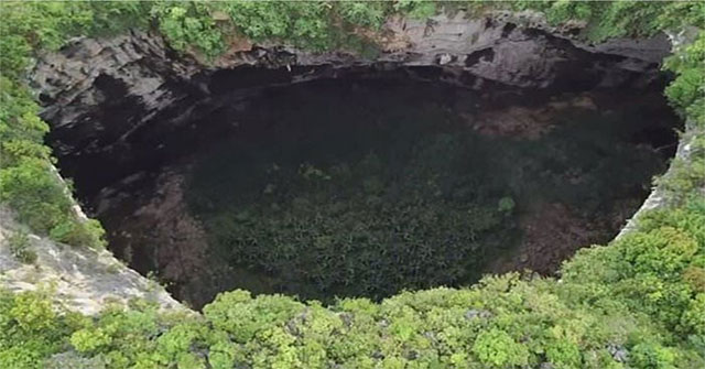 Discover a cluster of 19 giant sinkholes around the underground river