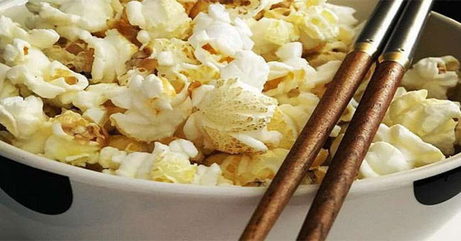 Eating popcorn with chopsticks, turns out the secret of happiness is simply that