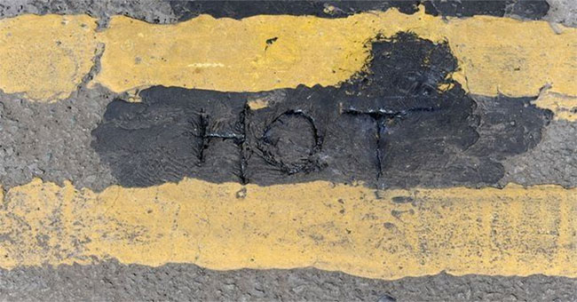 English street flows out, deformed because of the scary hot sun