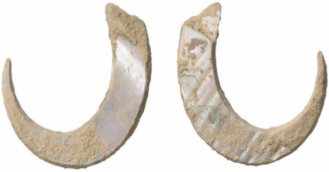 Find the world's oldest fishing hook