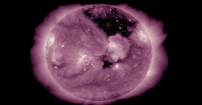 Giant black mark on the surface of the Sun.