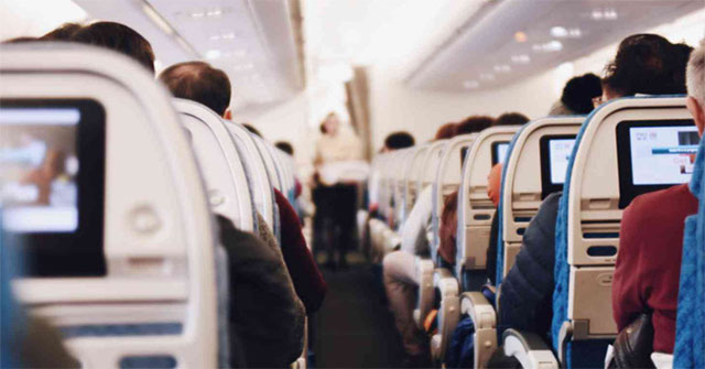 How is the virus spread if you share a plane with an ill person?