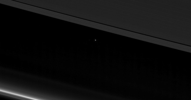 How small is the Earth when viewed from 870 million miles away?