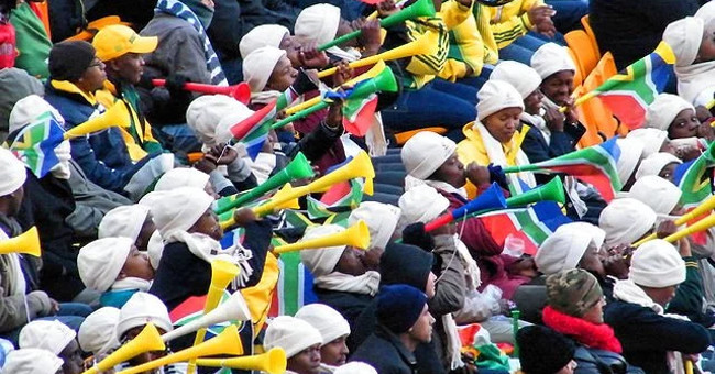 How was the bustling atmosphere in the stadium created?