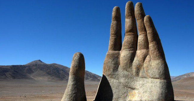 In the driest desert in the world, there is a giant hand that is calling for help.