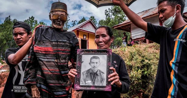Inside the 'village of death', where the villagers dig graves, wear new clothes for the body
