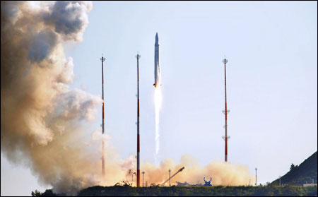 Korea launches missiles carrying satellites