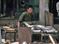 Machine coated a rolls of a farmer