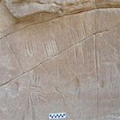 Mysterious spider figure on stone during the opening ceremony of mummy mouth