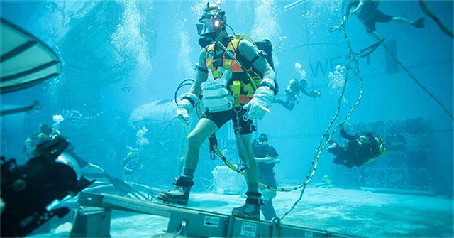 NASA astronaut training in a pool of water preparing to go to the Moon