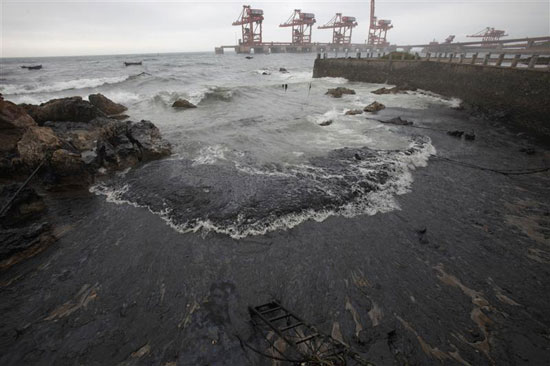 Oil off China flows ashore