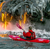 Paddle board next to lava flow 1000 degrees Celsius