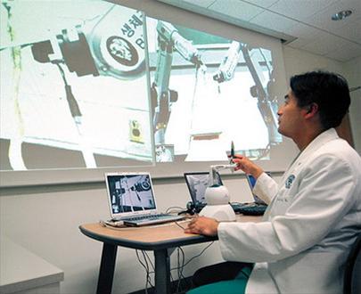 Robot surgery via the Internet