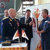 Russia 'plays' the Olympic torch on the universe
