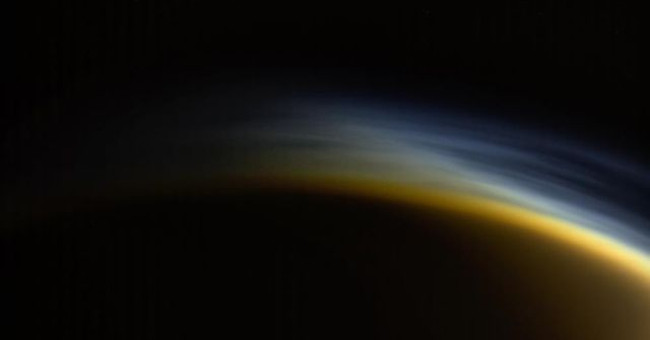 See the 'foggy sunset' on Saturn's moon
