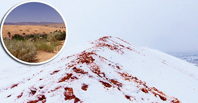 Snow is dyed red like blood covering the Sahara desert