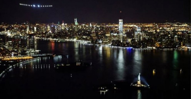 Solar Impulse 2 flies in the sky and lands New York