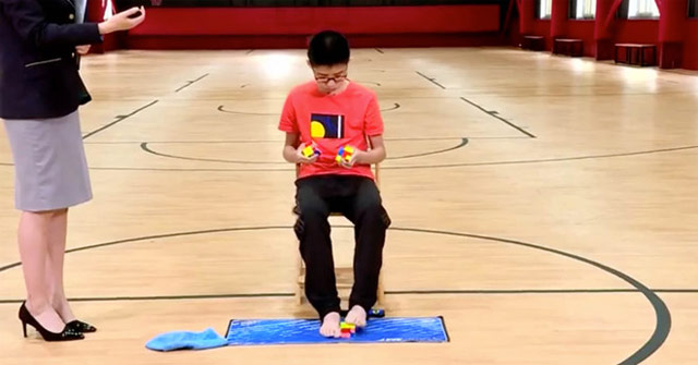 Solve 3 rubik blocks with both hands and feet