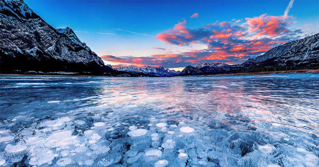 Stand in front of the cold beauty of frozen lakes