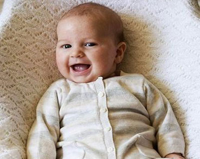 Strange baby grinning from the womb