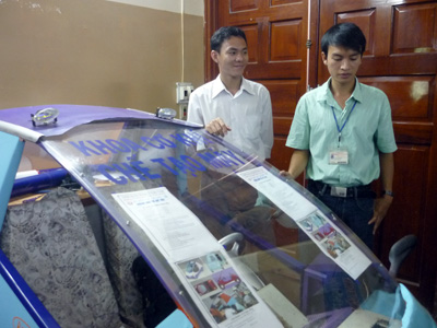 Students manufacturing gasoline-electric vehicles