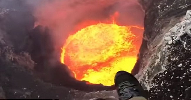 Stun with the pilot hovering over the spraying crater