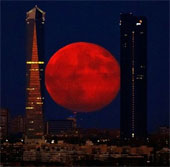Super bright red moon in the sky of Spain
