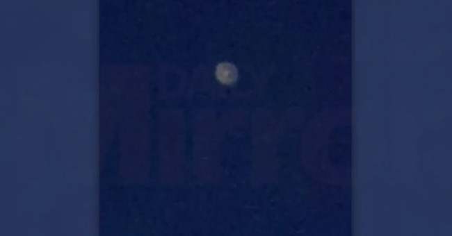 Suspicious alien ship object hovering over British city
