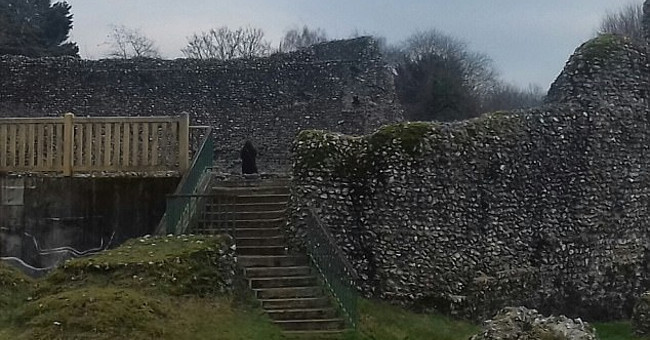 Taking photos of the medieval castle, seeing people wearing mysterious black robes?
