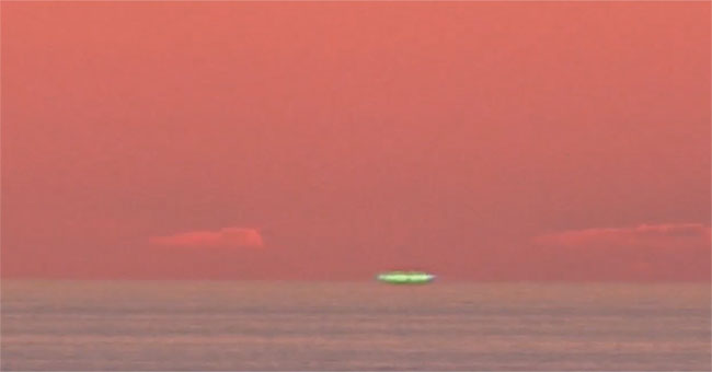 The blue halo appears when the Sun sets on the sea