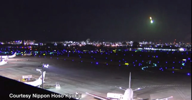 The bright blue fire bridge flashes through the sky of Japan