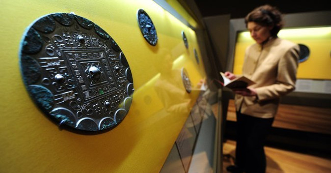 The bronze mirror is still shiny after 1,900 years underground