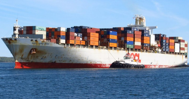 The cargo ship is over 200,000 tons long by four football fields