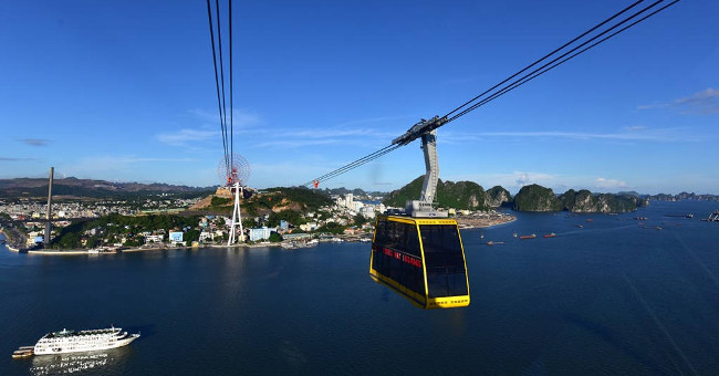 The 'double-decker bus' cable car floats above Ha Long Bay