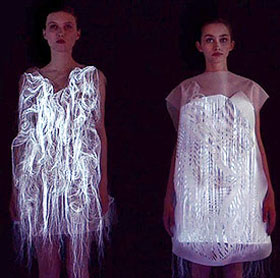 The dress itself twists, glows when someone looks