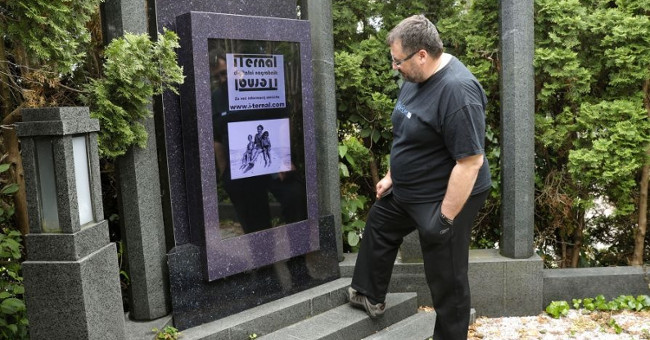 The grave emits sounds and images when people come close