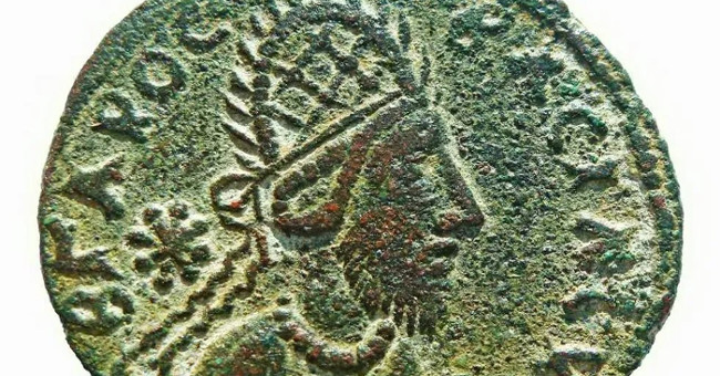 The image depicts the portrait of Jesus on an ancient coin