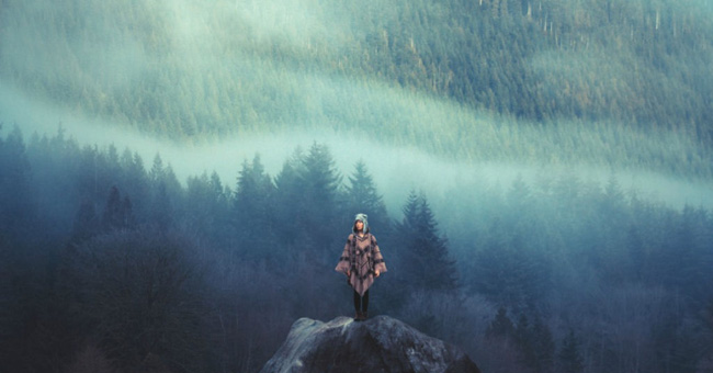 The image of small people before majestic nature
