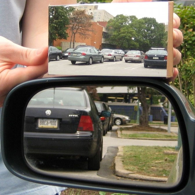 The invention of a mirror with a much wider viewing angle than a conventional mirror