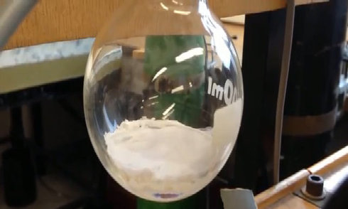 The liquid boils and freezes at the same time