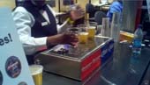The machine poured beer from the bottom of the pouring cup