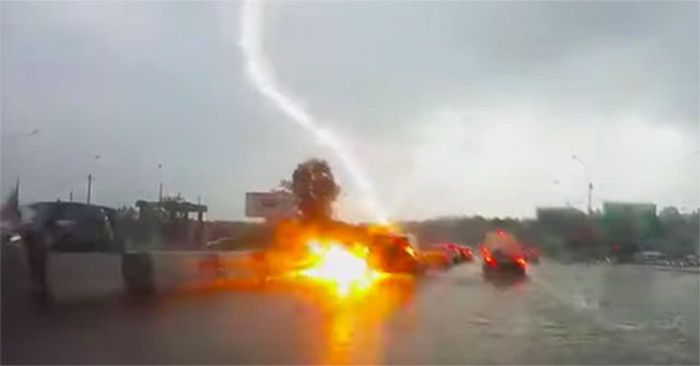 The moment two lightning strikes hit the car on the road, the lucky driver escaped death