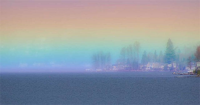 The rainbow is horizontal on the lake