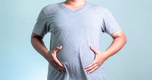 The strange man has his stomach ... brewing beer