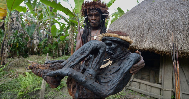 The tribe sleeps with the ancestral dried, smoked mummy