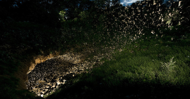The whirlwind of bats pours out from the most bat-like cave in the world