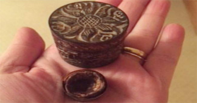 The wife holds the chocolate Valentine gift for 33 years