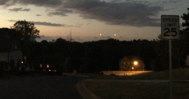 The witness tells of the time of encountering 2 giant UFO fireballs